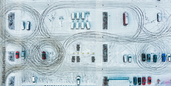 Obraz Aerial top view parked snow covered cars. Many snowy cars on the parking at the winter snowfall