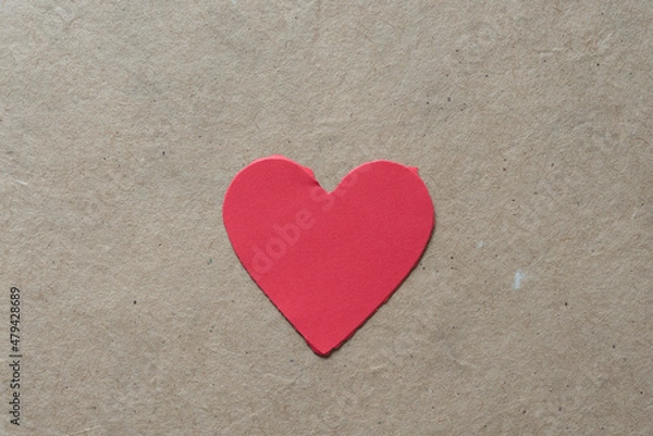 Fototapeta torn paper heart on cardboard
