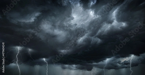 Fototapeta Thunderous dark sky with black clouds and flashing lightning. Panoramic view. Concept on the theme of weather, natural disasters, storms, typhoons, tornadoes, thunderstorms, lightning, lightning.