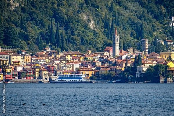 Fototapeta Citty of Varenna, lake como, italy, view from lake with ferry in foreground crossing