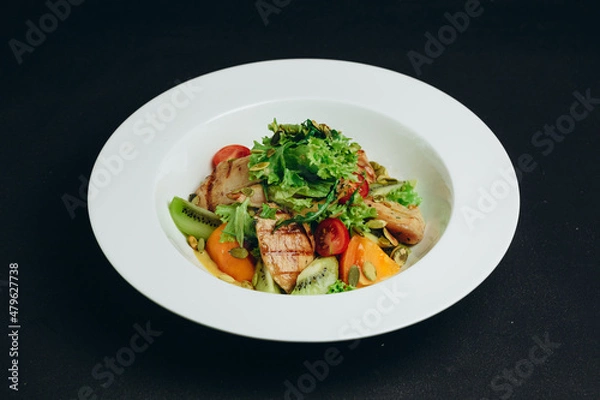 Fototapeta The new kind of salad is made by the chef.