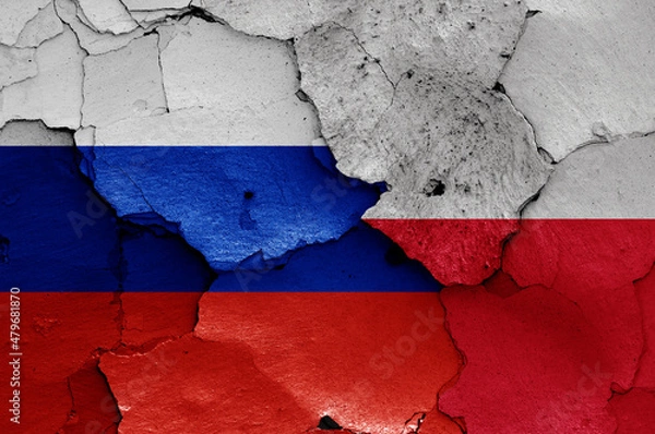 Obraz flags of Russia and Poland painted on cracked wall