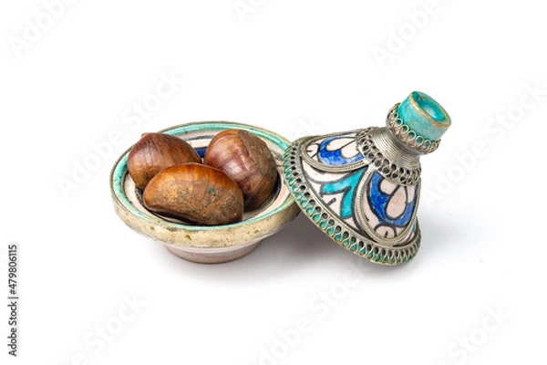 Obraz Chessnuts in a mini Moroccan tajine