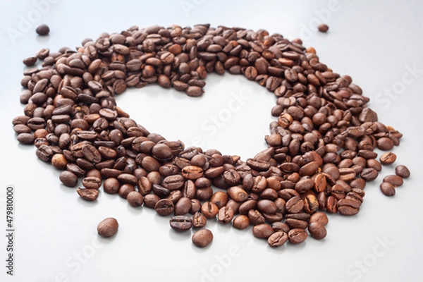 Obraz Coffee beans in a heart shape on the gray background. Blured background. Coffee lovers