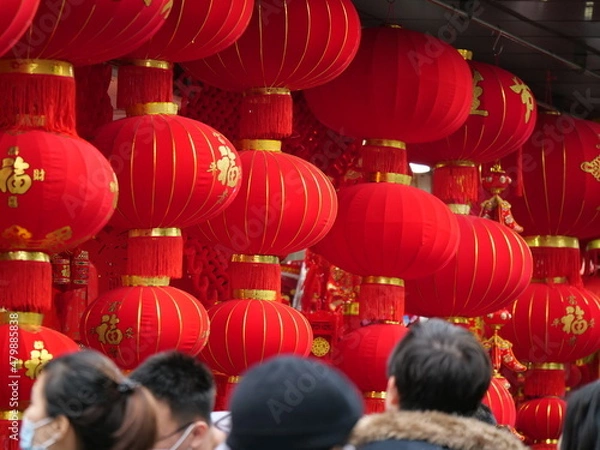 Fototapeta People and the traditional red lantern for Chinese New Year in Shanghai. Chinese New Year Holiday and culture concept photo. People in the new year market. Purchasing decorations for Chinese new year