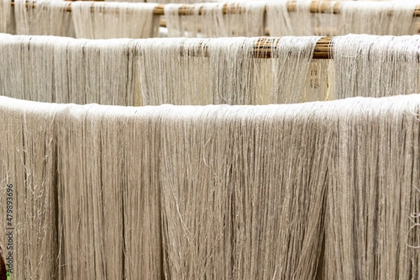 Fototapeta White silk threads for Persian carpet weaving