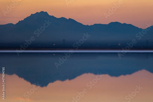 Obraz Orange sky and blue mountains and salt lake