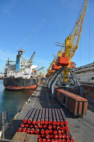 Fototapeta Pipe stack, ship ans train under crane bridge
