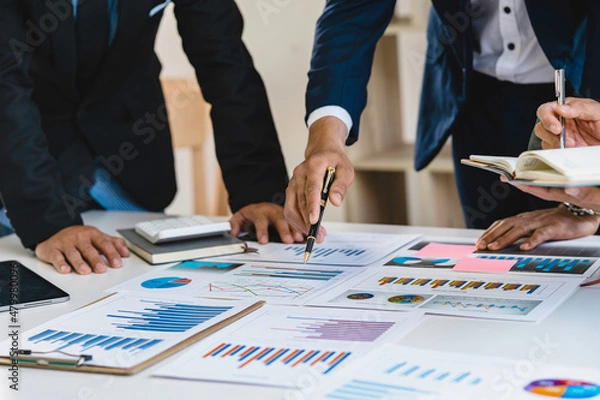 Fototapeta Meeting concept Business team hands at working with financial plan, meeting, discussion, brainstorm with tablet on the office desk,