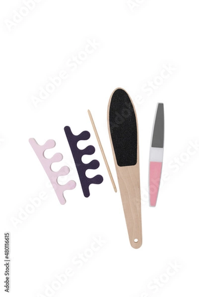 Fototapeta tools layout for pedicure isolate on white background toe separators, pumice stone and foot grater