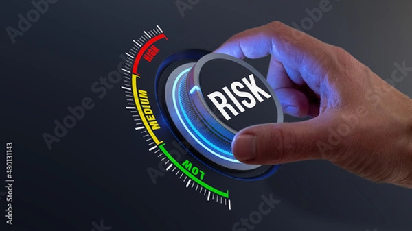 Fototapeta Risk management and mitigation to reduce exposure for financial investment, projects, engineering, businesses. Concept with manager's hand turning knob to low level. Reduction strategy.