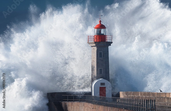 Obraz lighthouse on the coast during storm - wave crashing