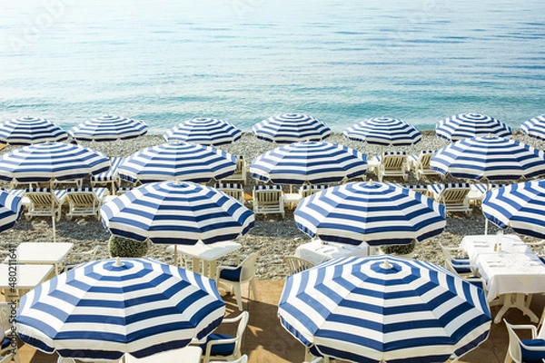 Fototapeta Beach and umbrellas on the Cote d'Azur in Nice