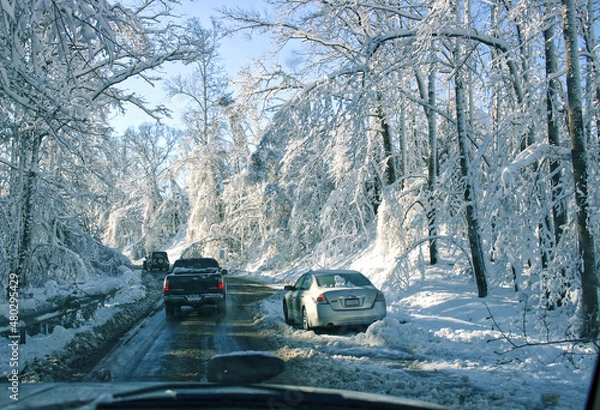 Fototapeta Vehicle Stuck in Snow on a Busy Route 1 Road After a Winter Snow Storm