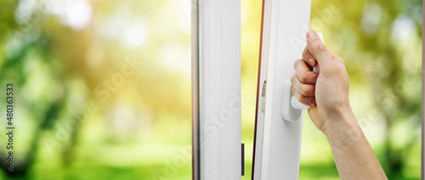 Fototapeta hand open plastic pvc window. banner copy space