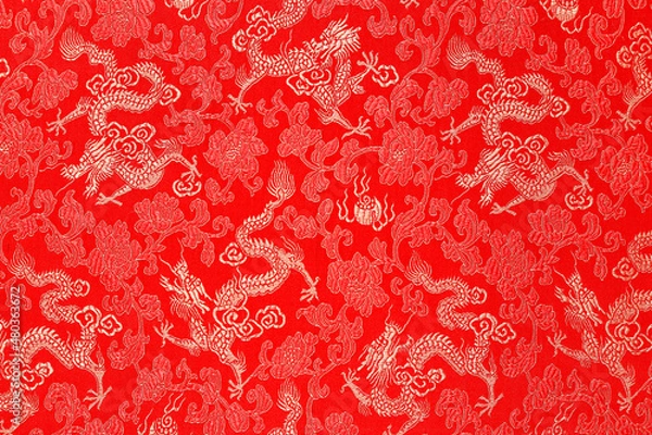 Fototapeta Red fabric with a dragon pattern. The concept of the Chinese New Year. copy space. Red background