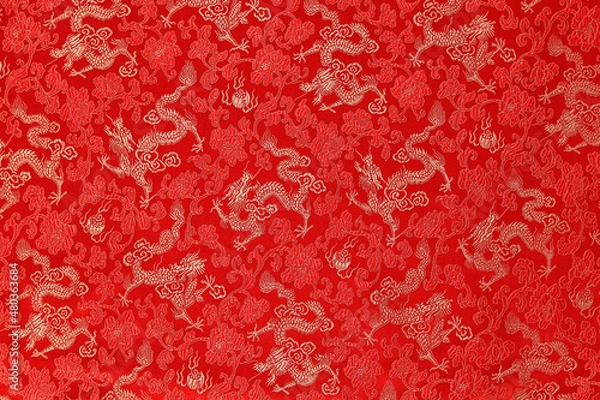 Fototapeta Red fabric with a dragon pattern. The concept of the Chinese New Year. copy space. Red background