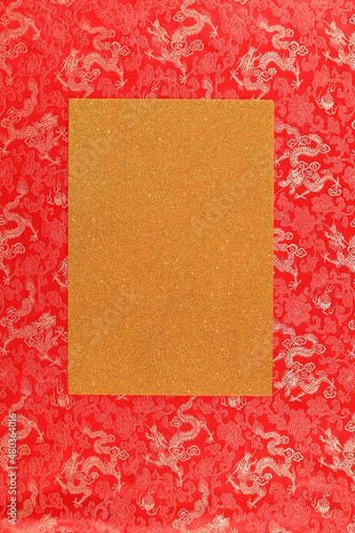 Fototapeta Red fabric with dragon pattern with gold copy space for text. The concept of the Chinese New Year. to copy space. Red background