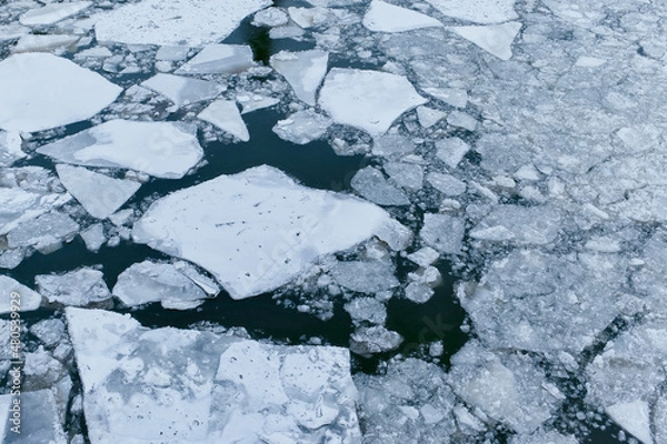 Obraz Ice floes on the water surface. Winter.