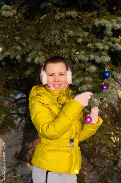 Obraz girl decorating christmas tree