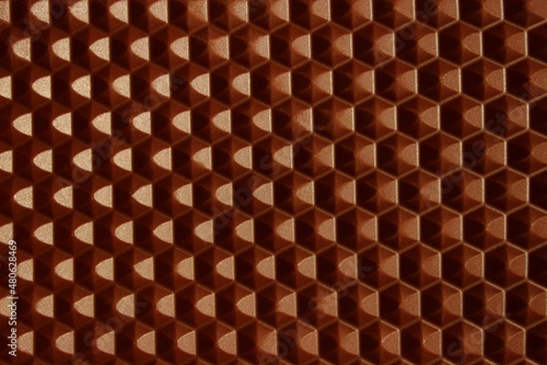 Fototapeta Cropped shot of milk chocolate texture background, horizontal view, honeycomb pattern. Food, dessert, textures concept. 