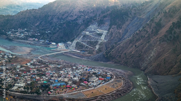 Obraz Birds eye view of city of town with beautiful beaches and mountain range on a sunny day. Aerial view of  Town city with Peak.