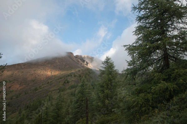Fototapeta time clouds over the mountains