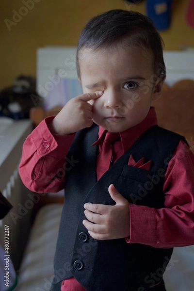 Fototapeta portrait of elegant little boy gesturing
