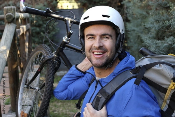 Fototapeta Man doing backpacking with bicycle