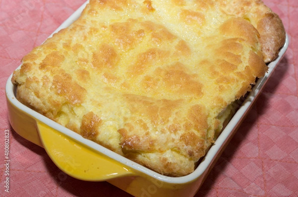 Obraz Fluffy egg casserole in yellow ceramic for breakfast.