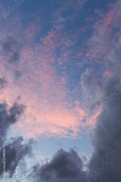 Fototapeta dark grey clouds on pink sunset
