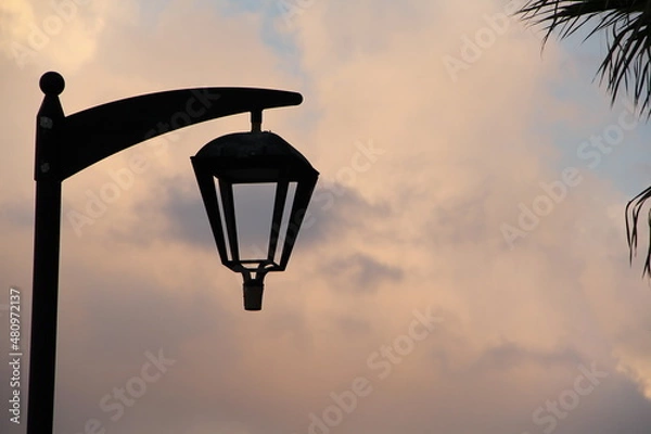 Obraz old street lamp on sunset background