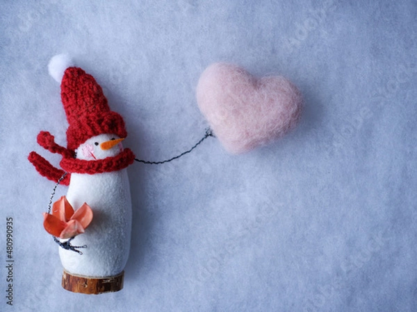 Obraz snowman with heart on white background