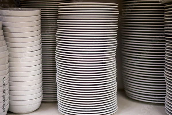 Fototapeta a stack of plates in a restaurant kitchen