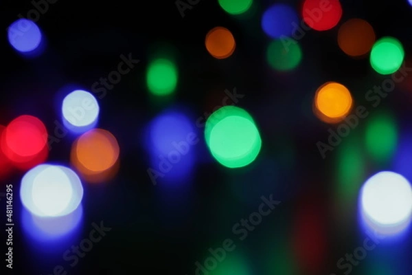Fototapeta colored bokeh on a black background