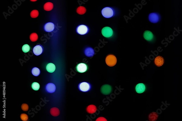 Obraz colored bokeh on a black background