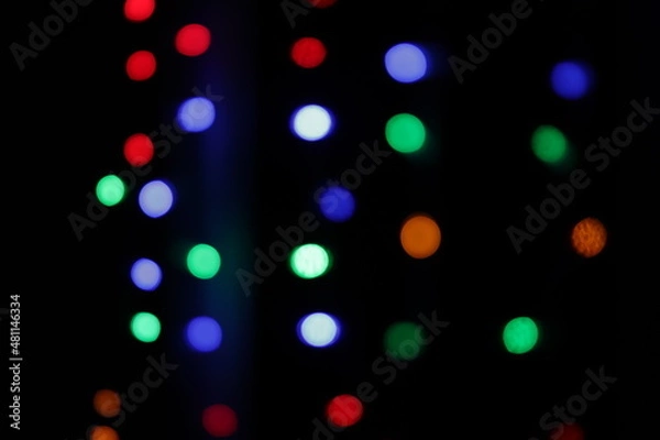 Fototapeta colored bokeh on a black background