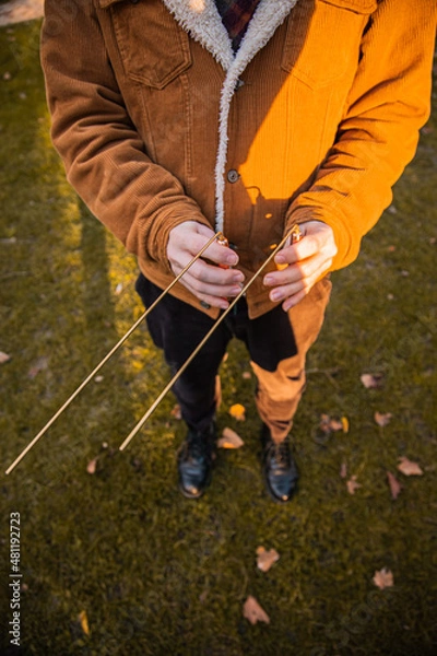 Fototapeta Man holding dowsing rod outside