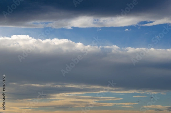 Fototapeta A light of blue sky through heavy clouds.