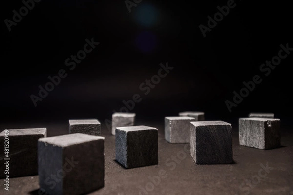 Fototapeta Whiskey cubes lie on a dark background. Stones for cooling drinks. High quality photo