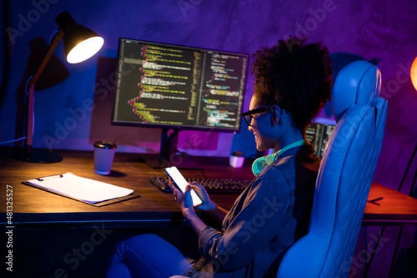 Fototapeta Photo of lady freelancer sit desk use gadget screen texting client operating system support in evening late workplace workstation