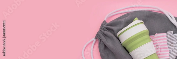 Fototapeta Trendy environmental friendly reusable cup. Folded reusable cotton menstrual pads. Grey shopping mesh bag. Concept of conscious consumption. Alternatives to disposables banner
