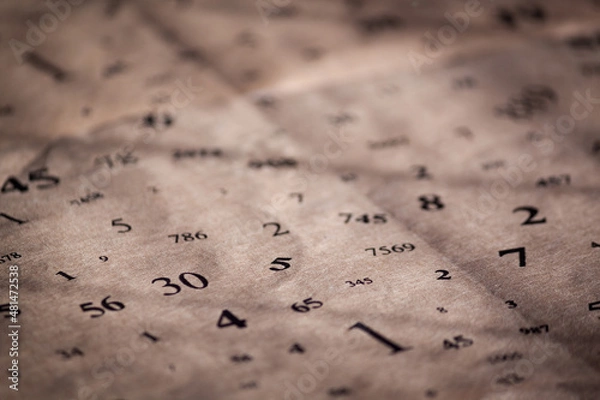 Obraz Old paper with different numbers. Numerology concept.