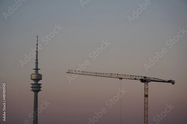 Fototapeta sunset munich with crane and olympic tower