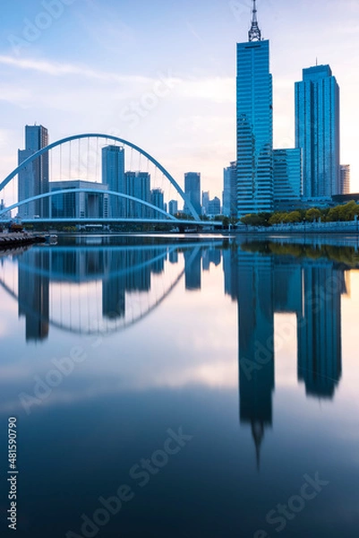 Obraz In the evening, the city skyscrapers are reflected on the water, and the picture is very beautiful