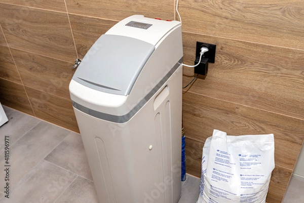 Obraz Homemade water softener standing in the boiler room with the lid closed.