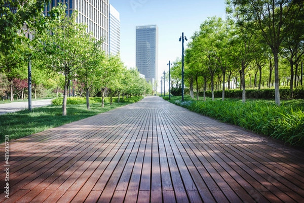 Obraz Cityscape intelligent building ,hold smart phone for build and make your green city.