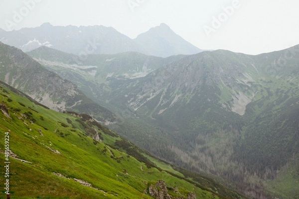 Fototapeta Scenic view of high mountains.