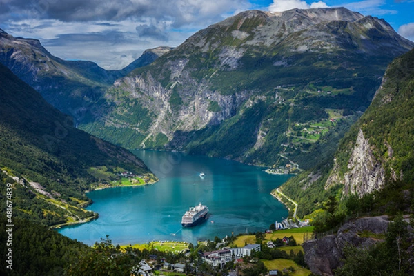 Fototapeta Cruise ships stand in the harbor of the Geiranger fjord, Norway