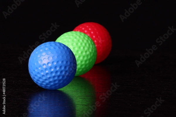 Obraz COLOURFUL GOLF BALLS ON BLACK BACKGROUND 